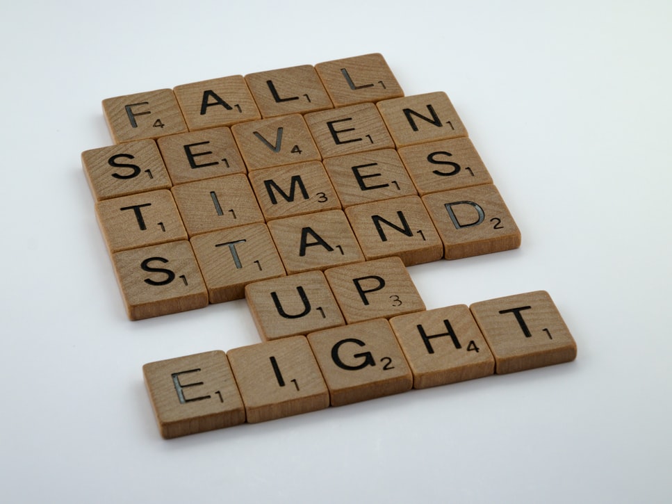 Scrabble tiles that read fall seven times stand up eight